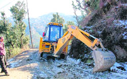 PWD workers busy in clearing the snow-covered Summer Hill- Neri road near Shimla 