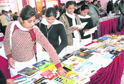 Girls at a book fair in Government Girls Senior Secondary School, Shastri Nagar, Jammu on Tuesday.