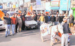 Activists of the BJP hold a demonstration against escalating prices of fuel in Jalandhar