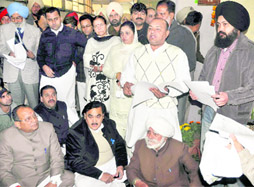 Congress councillors stage a protest outside the venue of the general house meeting in Ludhiana on Tuesday.
