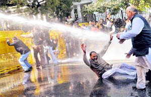 Agitating BJP workers face water cannons in New Delhi on Tuesday.