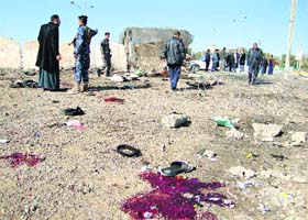 Cops at the spot where the suicide bomber blew himself up in Tikrit