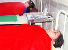 Two health employees at the Phase VI hospital in Mohali on Wednesday. 