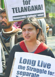 Activists of the Democratic Students Union hold a protest to demand a separate Telangana state at Jantar Mantar in New Delhi on Wednesday.
