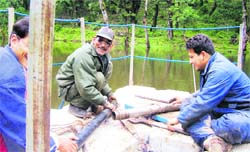 Geologists study a lake in the Kumaon region.