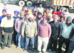 Truck operators outside the Karnal railway station. 