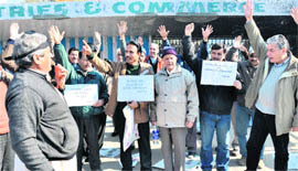 Members of the Jammu and Kashmir Vichar Manch hold a demonstration outside the Exhibition Ground in Jammu