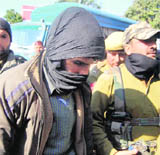 Divisional commander of Hizbul Mujahideen Javed Qureshi being taken to a court in Dehradun on Wednesday.