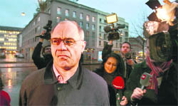 Swiss private banker Rudolf Elmer arrives before a trial at the regional court in Zurich 