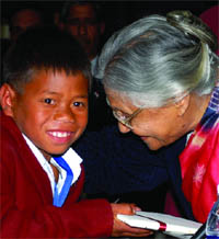 Chief Minister Sheila Dikshit interacts with a bravery awardee child at her residence in New Delhi 
