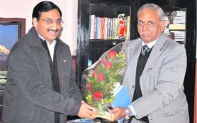 Vice-Chancellor of Uttarakhand Ayurveda University Satyendra Mishra meets Chief Minister Ramesh Pokhriyal Nishank in Dehradun on Thursday.