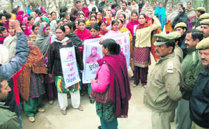 Residents protest at Balh police station in Mandi on Thursday.