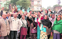 Members of the Mahasha Sadar Sabha protest in support of their demand for the shifting of a slaughter house from Dogra Hall in Jammu on Thursday