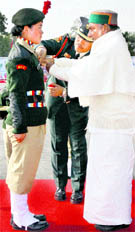Defence Minister AK Antony presents the commendation card to NCC girl cadet from Leh, Yeshi Wangmo, in Delhi on Thursday