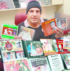 Kesar a custodian of a collection centre, displays some CDs of prominent plays staged at the Desh Bhagat Yaadgar Hall in Jalandhar.