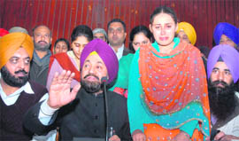 Balwant Singh Ramoowalia addresses mediapersons in Jalandhar on Thursday. To his left is Sandeep Kaur, who was married to an NRI. 
