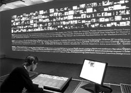 A visitor studies a digital work of art at the ZKM art museum in Karlsruhe, Germany. Monika Fleischmann and Wolfgang Strauss created this 2007 installation for a show entitled Covering the Net, Performing the Archive