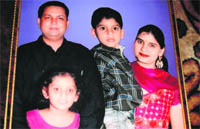 A file photo of Ranmeet Kaur with her husband Jaskaranjit Singh and children
