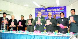 Chief Minister Omar Abdullah releases a collection of Urdu poems, Warood by Khalid Karar, prominent Urdu poet, in Jammu on Friday.