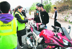 Volunteers of the Civil Defence check vehicles ahead of the Republic Day celebrations in Jammu.