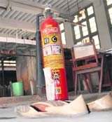 A fire extinguisher and slippers lying in the lab after the explosion.