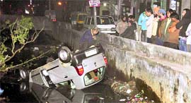 The car that fell in a nullah near the Civil Hospital in Ludhiana on Thursday night.