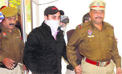 Jagdeepak Singh, the main suspect in the murder case, in police custody in Jalandhar