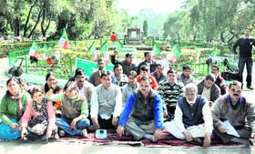 UKD workers stage a dharna at the Gandhi Park in Dehradun