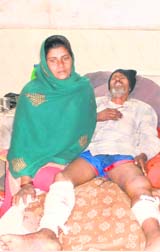 The victim, Kalicharan, with his wife Rajeshwari in Fatehabad on Saturday.
