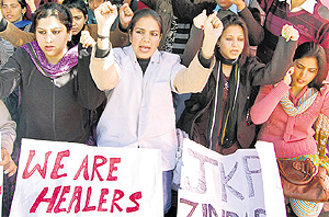 Members of the J&K Physiotherapists Association protest in support of their demands in front of the Divisional Commissioners office in Jammu on Saturday.