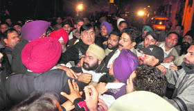 Supporters of Deputy Speaker Satpal Gosain and angry residents enter into a scuffle after the midnight shootout incident in Ludhiana.
