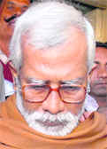 Swami Aseemanand being produced at a court in connection with Ajmer Dargah blast in Ajmer on Saturday.  PTI