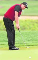 Phil Mickelson putts on the seventh green during the third round of the Abu Dhabi Golf Championship on Saturday.