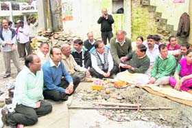 Municipal Council President OP Uniyal and others perform a pooja at the Clock Tower in Mussoorie