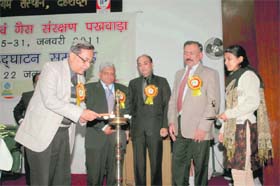 Dr Girijesh Pant, Vice-Chancellor, Doon University, lights the traditional lamp to start the Oil and Gas Conservation Fortnight in Dehradun