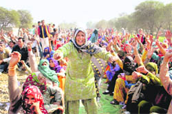 Villagers continue to block the rail track at Jind demanding transfer of undertrials of Mirchpur violence from Tihar to Hisar jail on Sunday. 