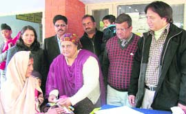 Usha Devi, president, Municipal Council, administers polio drops to a child at civil hospital in Ahmedgarh on Sunday.
