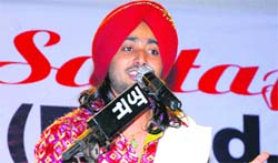 Dr Satinder Sartaj performs at Mandi Gobindgarh on Saturday evening.