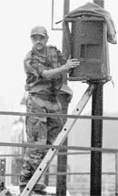 An Army jawan sets up speakers for the Republic Day parade in New Delhi on Sunday.