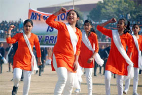 School children perform at the full-scale dress rehearsal for the Republic Day parade at the Sports Stadium in Bathinda on Monday