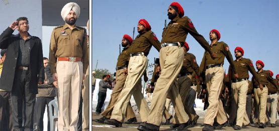 Bathinda DC S. Karuna Raju and SSP Sukhchain Singh Gill at the marchpast. (Right) Jawans of the Punjab Police take part in the parade.