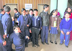 Students of Joy Lall’s Centre for Learning Disability, along with their parents, wait to meet the DEO in Chandigarh on Monday.