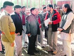   Senior civil and police officials inspect Republic Day celebrations at the Parade Grounds in Dehradun on Monday.