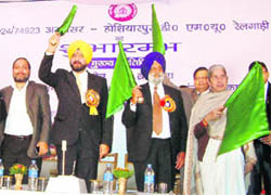 MP Navjot Singh Sidhu, Punjab Vidhan Sabha Speaker Nirmal Singh Kahlon and Punjab Health Minister Laxmi Kanta Chawla flag off the Amritsar-Hoshiarpur DMU at the Amritsar Railway Station on Monday.