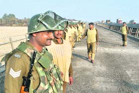 CRPF jawans step up vigil ahead of the BJPs Rashtriya Ekta Yatra on the national highway in Jammu