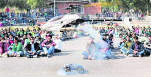 Students of the Chandigarh College of Engineering and Technology (CCET), Sector 26, watch the air show in Chandigarh on Tuesday.