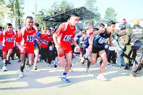 Youths participate in a cross-country race on Republic Day eve