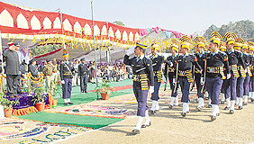 Chief Minister PK Dhumal takes a salute from the parade during the Statehood Day function at Hamirpur on Tuesday. 