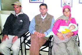 Ashutosh with his mother, father and Dr Naresh Kalia (centre).