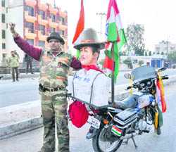 Vijay Kant Chauhan, a resident of Saharanpur in Uttar Pradesh, with his motorcycle in Kathua on Tuesday. He is on his way to hoist the National Flag at Lal Chowk on Republic day.